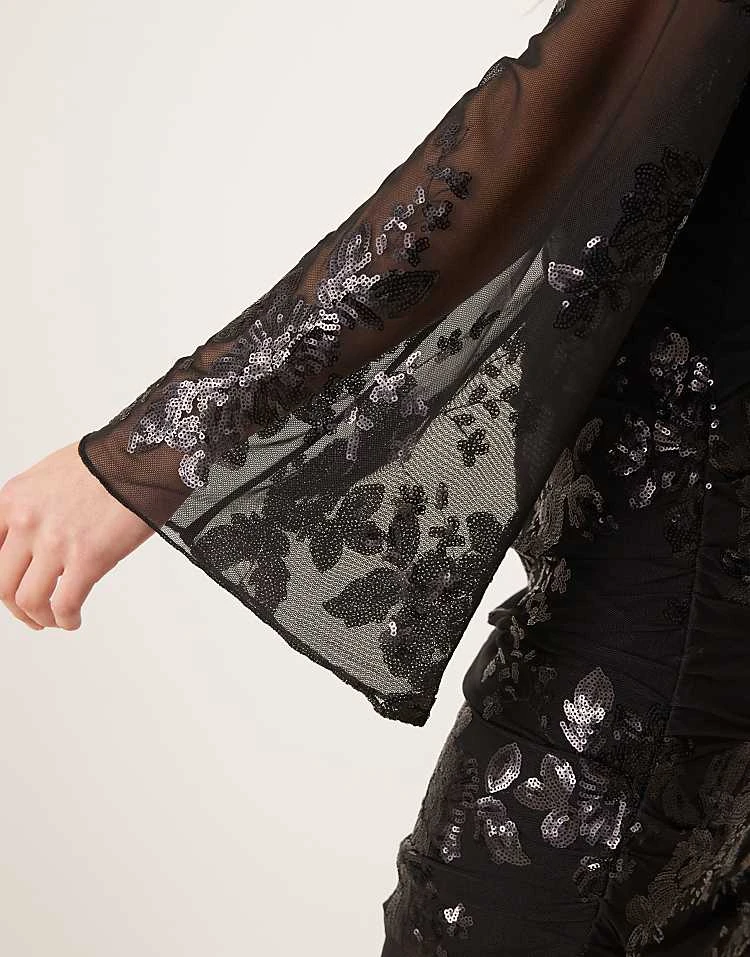 Gina Tricot Mini Dress With Wrap Front In Black With Textured Shimmer Jacquard Floral Pattern For Women 4 Gina Tricot Mini Dress With Wrap Front In Black With Textured Shimmer Jacquard Floral Pattern For Women - Image 2