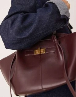 Gina Tricot Faux Leather Small Tote Bag With Strap And Clutch Detail In Burgundy For Women -Curated Apparel Shop 208218040 4